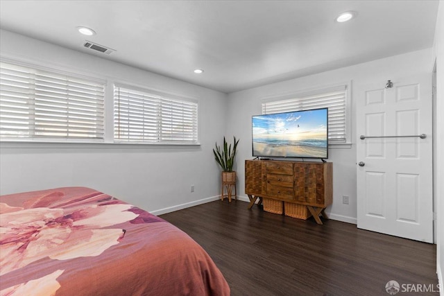 bedroom with dark wood-type flooring
