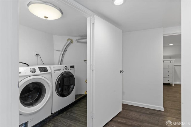 washroom with dark hardwood / wood-style flooring and independent washer and dryer