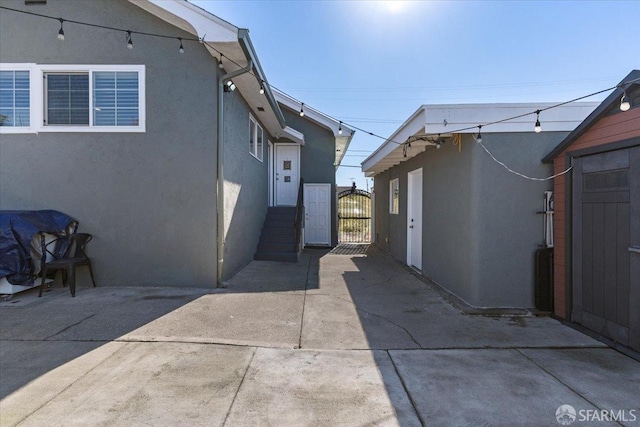 view of side of home featuring a patio