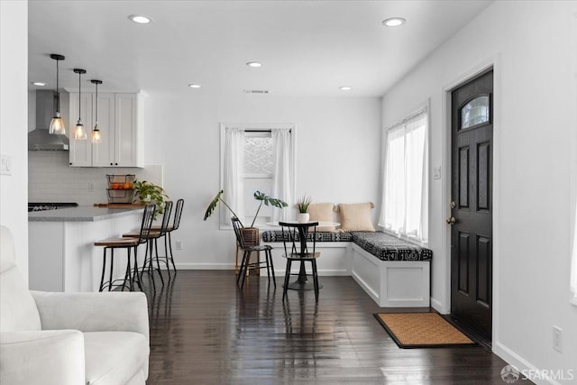 dining room with dark hardwood / wood-style flooring and breakfast area