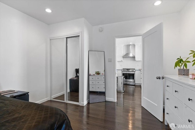 bedroom featuring dark hardwood / wood-style flooring and a closet