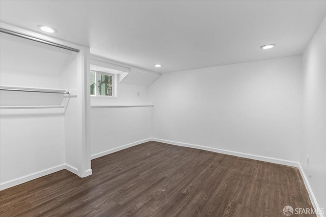 spacious closet with dark hardwood / wood-style floors