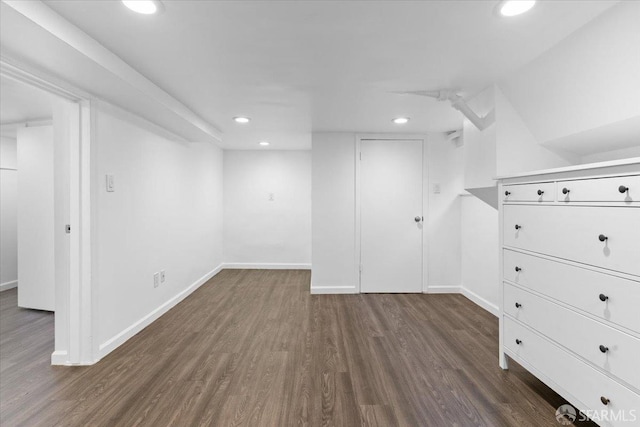 bonus room featuring dark wood-type flooring