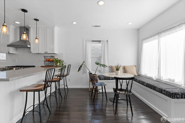 dining room featuring dark hardwood / wood-style flooring
