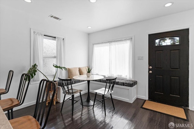 dining area with a healthy amount of sunlight, dark wood-type flooring, and breakfast area