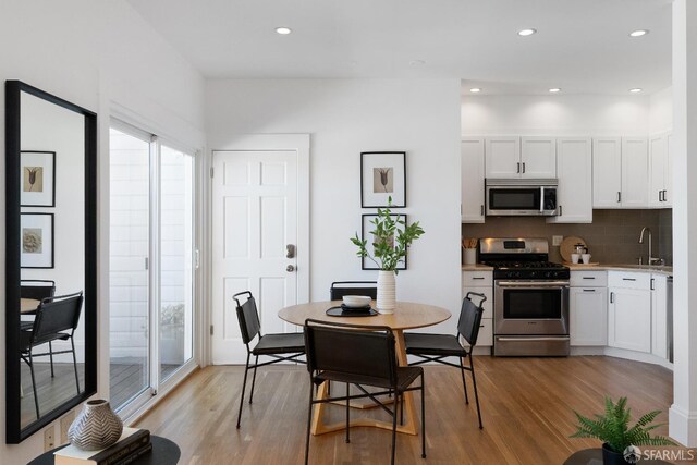 1141 Church St, San Francisco, CA 94114 - dining space featuring light wood-style flooring and recessed lighting