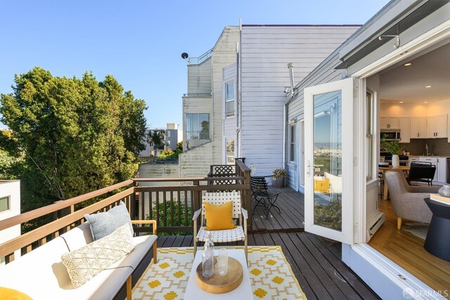 1141 Church St, San Francisco, CA 94114 - deck featuring a baseboard radiator and an outdoor hangout area