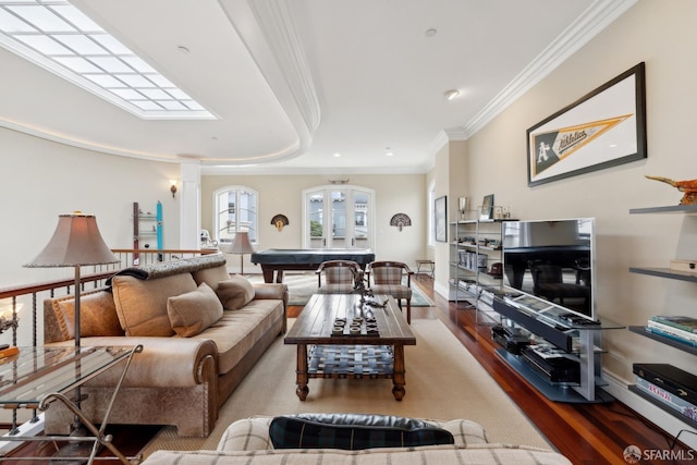 living room with hardwood / wood-style flooring, ornamental molding, and pool table