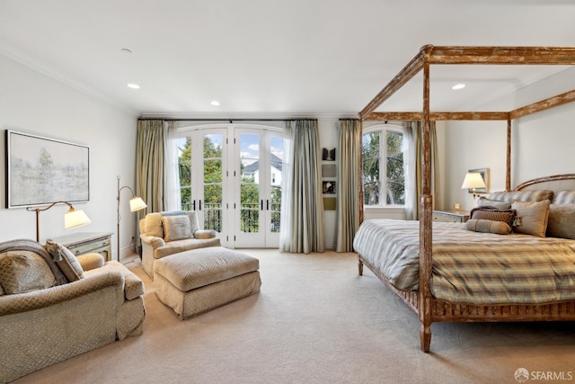 bedroom with light carpet, access to outside, ornamental molding, and french doors