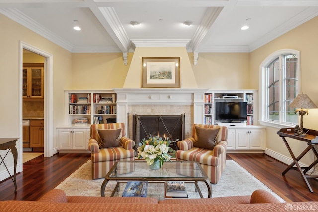 living room with beamed ceiling, a tile fireplace, ornamental molding, and dark hardwood / wood-style flooring