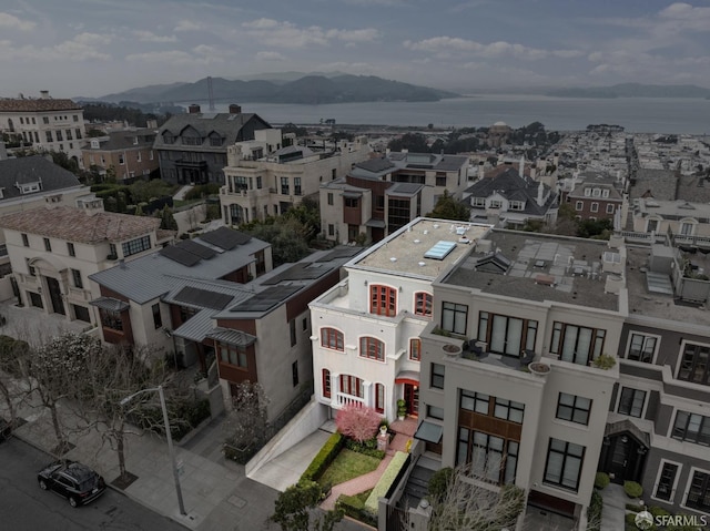 birds eye view of property with a mountain view