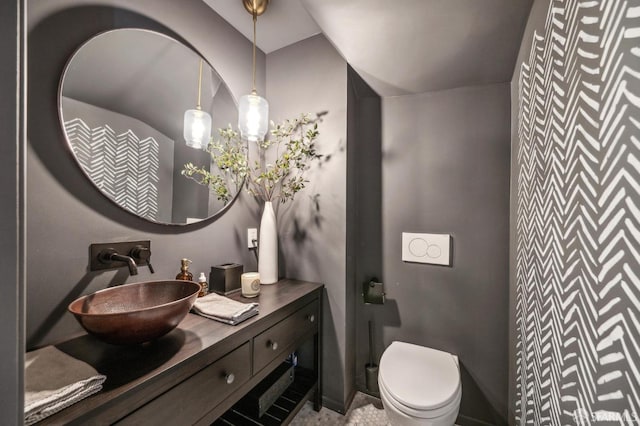 bathroom featuring vanity and toilet