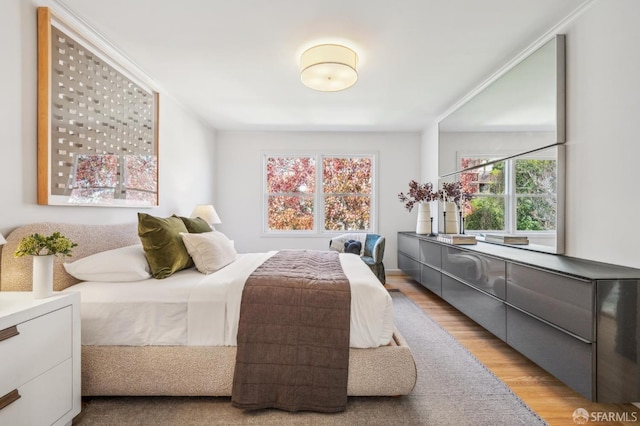 bedroom with light wood-style floors