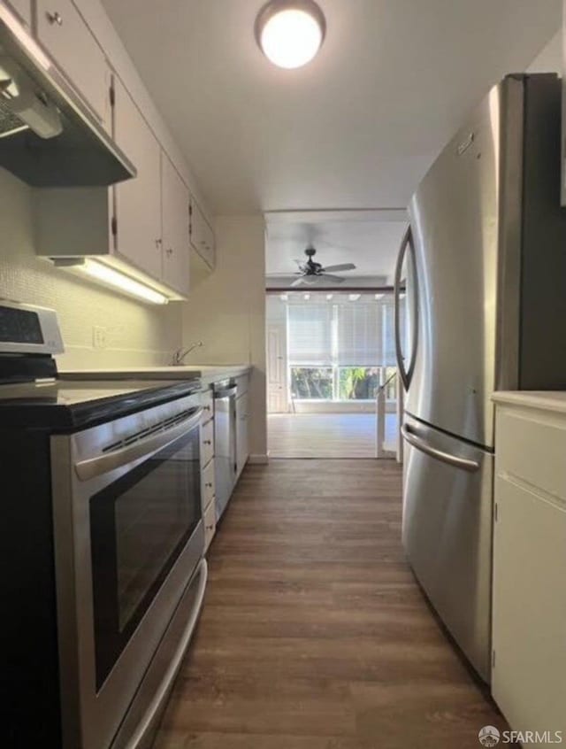 2013-2015 Golden Gate Ave, San Francisco, CA 94115 - kitchen featuring stainless steel appliances, ventilation hood, wood finished floors, a ceiling fan, and white cabinetry