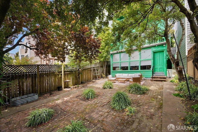 2013-2015 Golden Gate Ave, San Francisco, CA 94115 - fenced backyard with an outdoor living space, a patio area, and entry steps