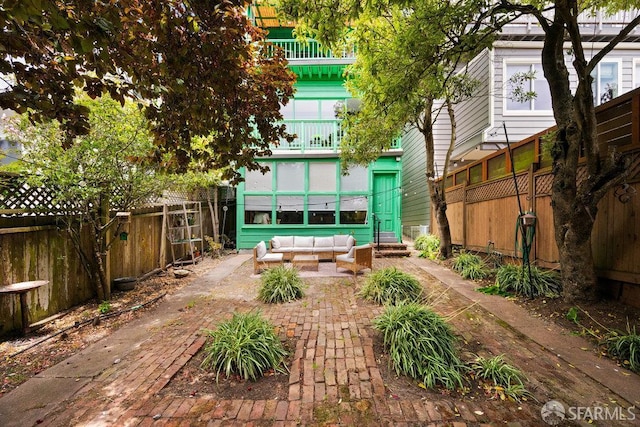 2013-2015 Golden Gate Ave, San Francisco, CA 94115 - fenced backyard featuring an outdoor living space, a patio, and entry steps