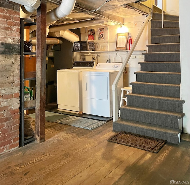2013-2015 Golden Gate Ave, San Francisco, CA 94115 - below grade area featuring washer and dryer, hardwood / wood-style floors, stairs, and brick wall