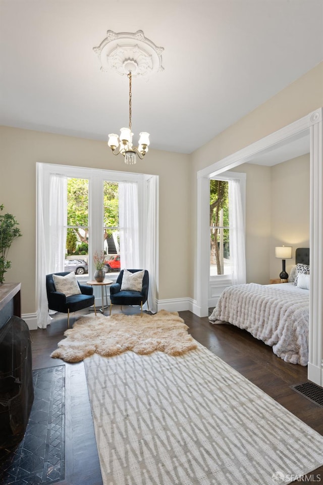 2013-2015 Golden Gate Ave, San Francisco, CA 94115 - bedroom featuring a chandelier and dark wood-type flooring