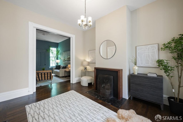 2013-2015 Golden Gate Ave, San Francisco, CA 94115 - living area with wood finished floors, a chandelier, and a fireplace with flush hearth