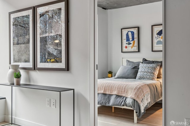 bedroom featuring wood finished floors