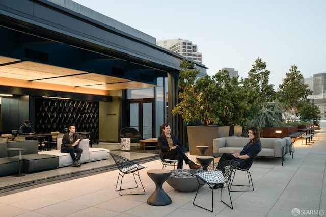 view of patio with a view of city and visible vents