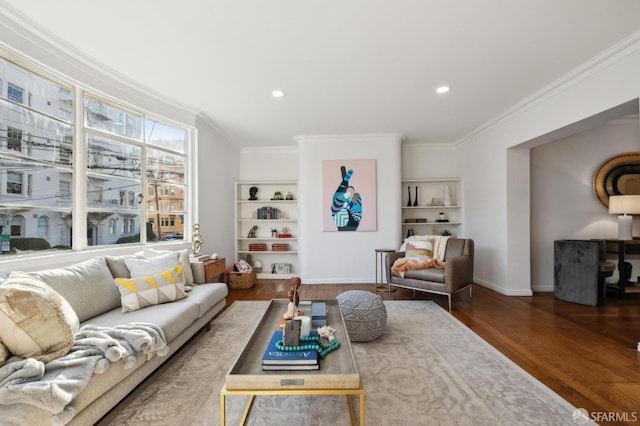 living room featuring dark hardwood / wood-style floors and ornamental molding