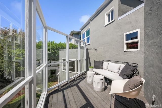 sunroom with an outdoor living space