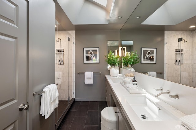 full bathroom with a shower stall, vanity, baseboards, toilet, and recessed lighting