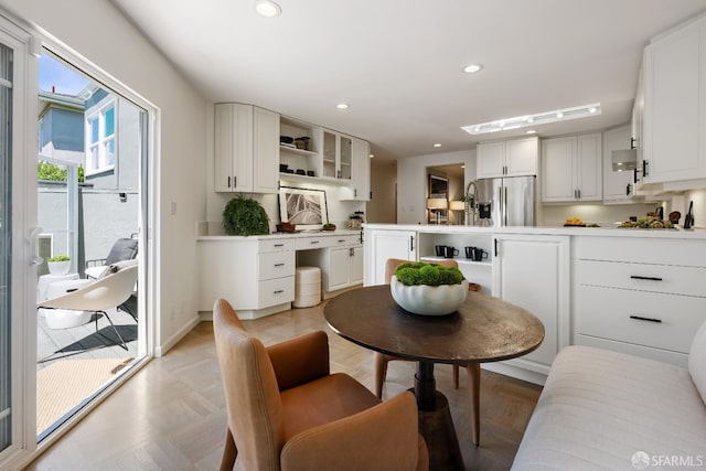 dining room with recessed lighting and baseboards