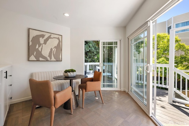 sunroom / solarium featuring recessed lighting and baseboards