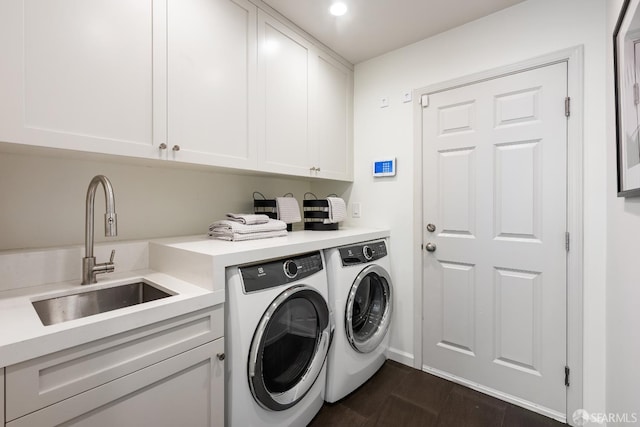 laundry room featuring washer and dryer, cabinet space, recessed lighting, and dark wood-style floors