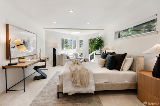 bedroom featuring multiple windows and recessed lighting