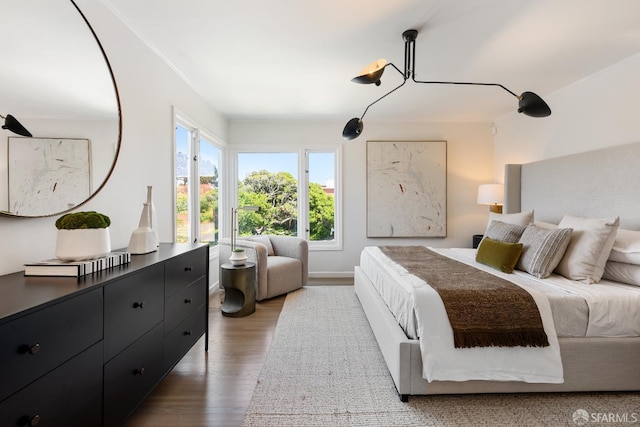 bedroom with wood finished floors