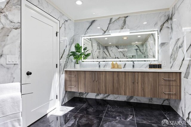 1098 Siler Pl, Berkeley, CA 94705 - bathroom with marble tiled floors, double vanity, a marble finish shower, and tile walls
