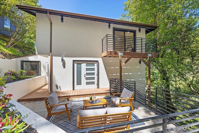 1098 Siler Pl, Berkeley, CA 94705 - rear view of property with stucco siding, outdoor lounge area, a balcony, and a wooden deck