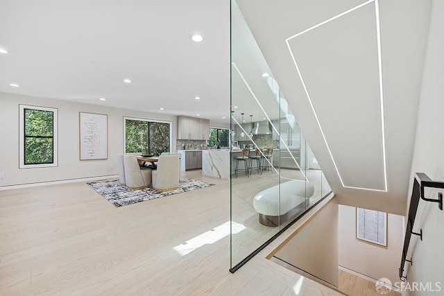 1098 Siler Pl, Berkeley, CA 94705 - stairway featuring plenty of natural light, wood finished floors, and recessed lighting