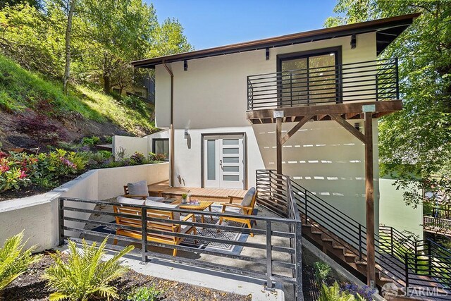 1098 Siler Pl, Berkeley, CA 94705 - rear view of house featuring a balcony, stucco siding, and stairs