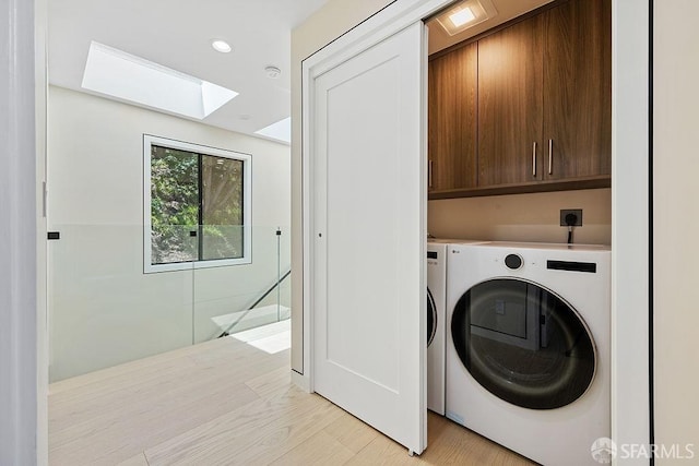 1098 Siler Pl, Berkeley, CA 94705 - laundry room with cabinet space, a skylight, independent washer and dryer, light wood finished floors, and recessed lighting