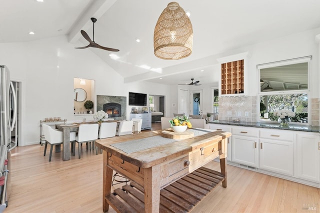 1316 Sulphur Springs Ave, Saint Helena, CA 94574 - kitchen featuring beam ceiling, backsplash, light wood-style floors, a premium fireplace, and ceiling fan