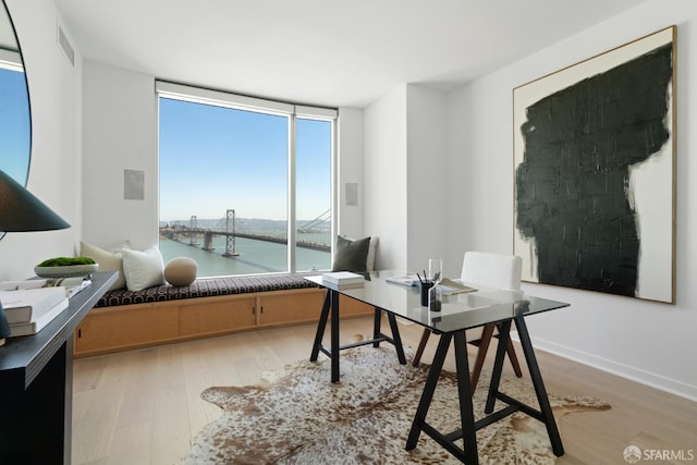 301 Main St Unit 34B, San Francisco, CA 94105 - office featuring floor to ceiling windows, light wood-style floors, and a water view