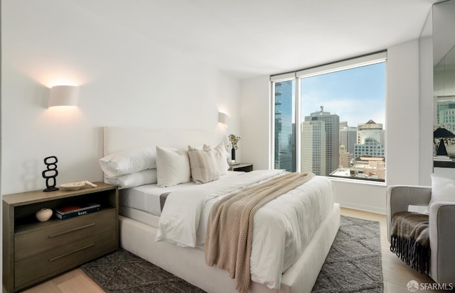 301 Main St Unit 34B, San Francisco, CA 94105 - bedroom featuring light wood-type flooring and a view of city