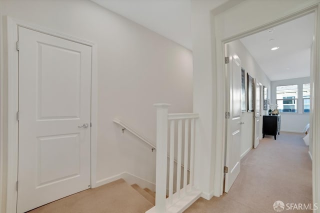 2702 Urbino Ct, San Jose, CA 95111 - corridor featuring an upstairs landing, light carpet, and baseboards