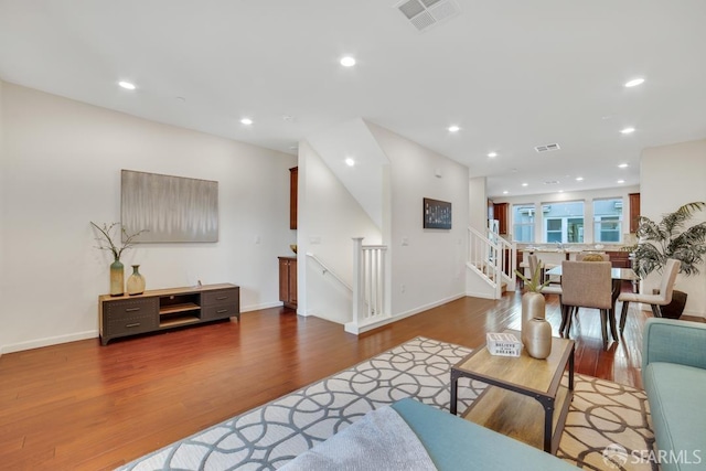 2702 Urbino Ct, San Jose, CA 95111 - living room with wood finished floors, recessed lighting, stairway, and baseboards