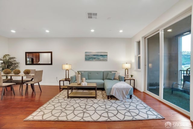2702 Urbino Ct, San Jose, CA 95111 - living room featuring dark wood-type flooring, recessed lighting, and baseboards