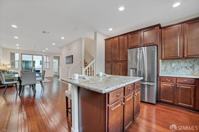 2702 Urbino Ct, San Jose, CA 95111 - kitchen featuring stainless steel fridge with ice dispenser, open floor plan, dark wood-style flooring, light stone countertops, and recessed lighting