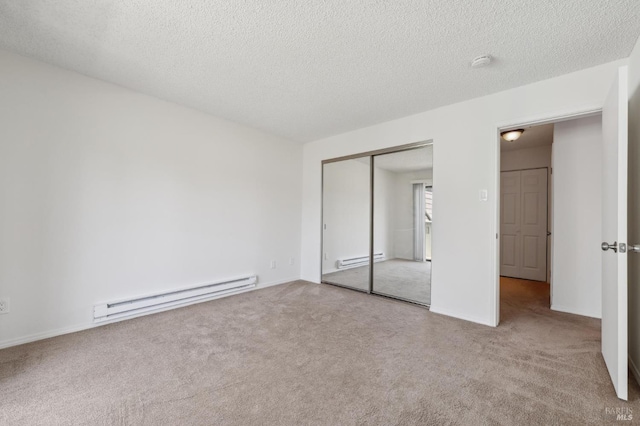 1201 Glen Cove Pkwy Unit 514, Vallejo, CA 94591 - unfurnished bedroom with a baseboard radiator, carpet floors, a closet, and a textured ceiling