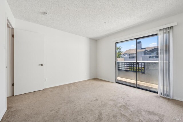 1201 Glen Cove Pkwy Unit 514, Vallejo, CA 94591 - carpeted empty room featuring a textured ceiling