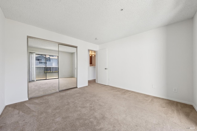1201 Glen Cove Pkwy Unit 514, Vallejo, CA 94591 - unfurnished bedroom featuring carpet flooring, a textured ceiling, a closet, and baseboards