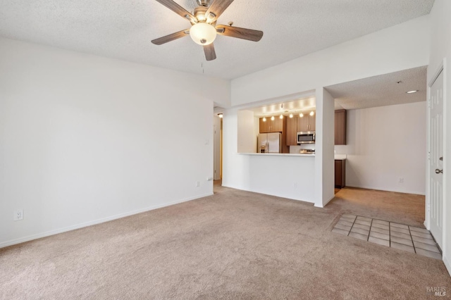 1201 Glen Cove Pkwy Unit 514, Vallejo, CA 94591 - unfurnished living room with light carpet, ceiling fan, a textured ceiling, and baseboards