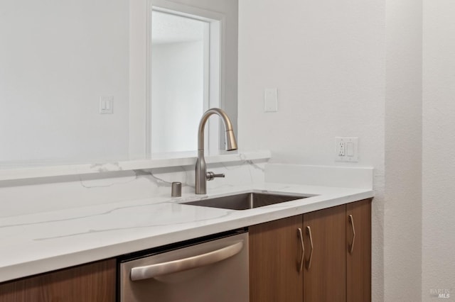 1201 Glen Cove Pkwy Unit 514, Vallejo, CA 94591 - kitchen featuring stainless steel dishwasher, light stone countertops, and a sink